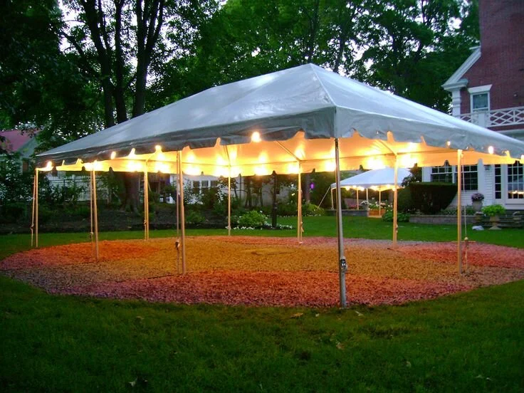 Elegant evening tent setup with warm lighting